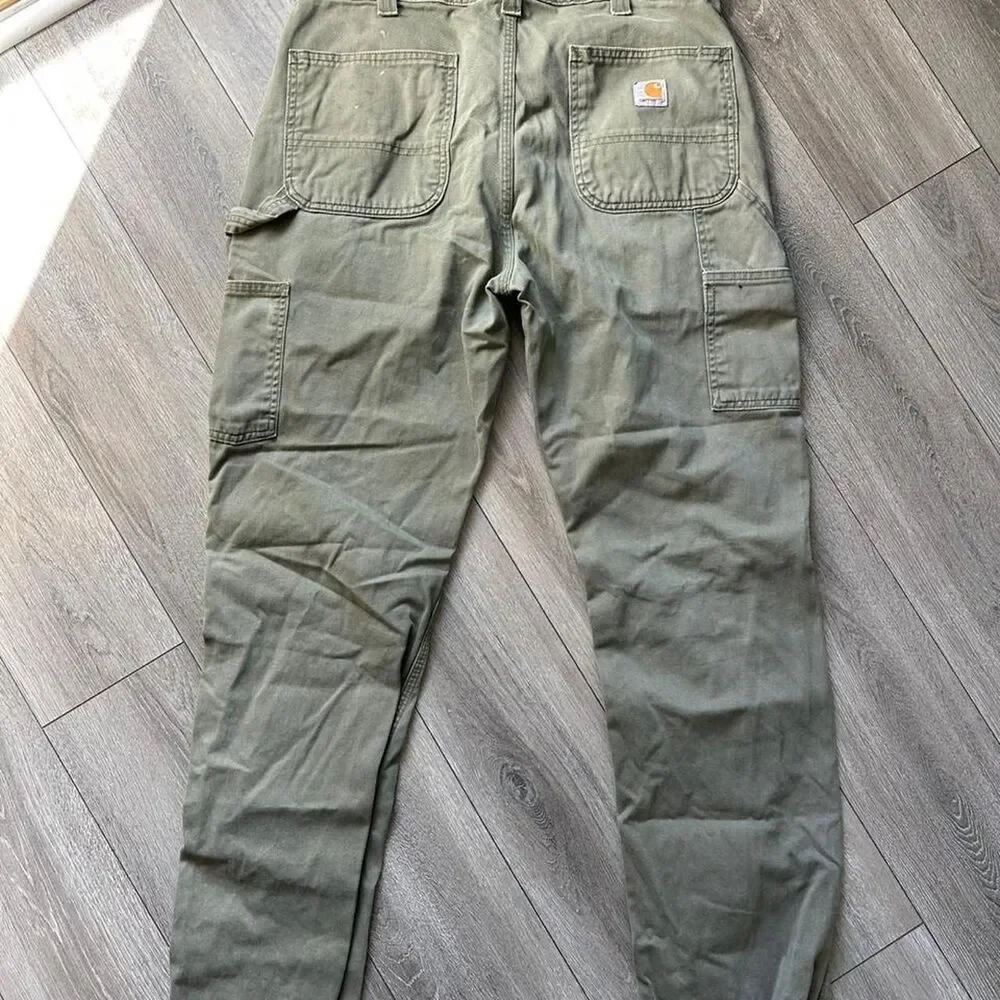 Distressed Carhartt relaxed fit olive green pants some staining  Size 34 x 34